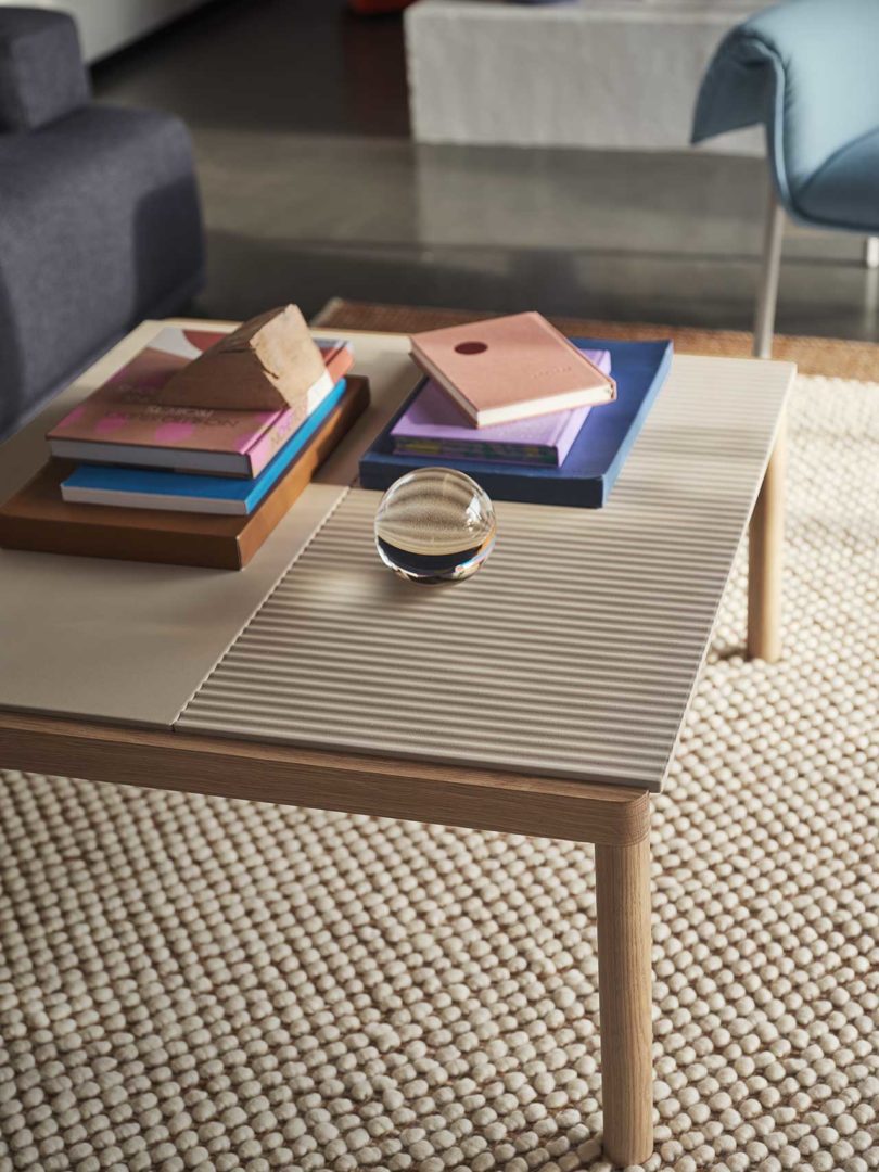 styled square wood coffee table with striated surface