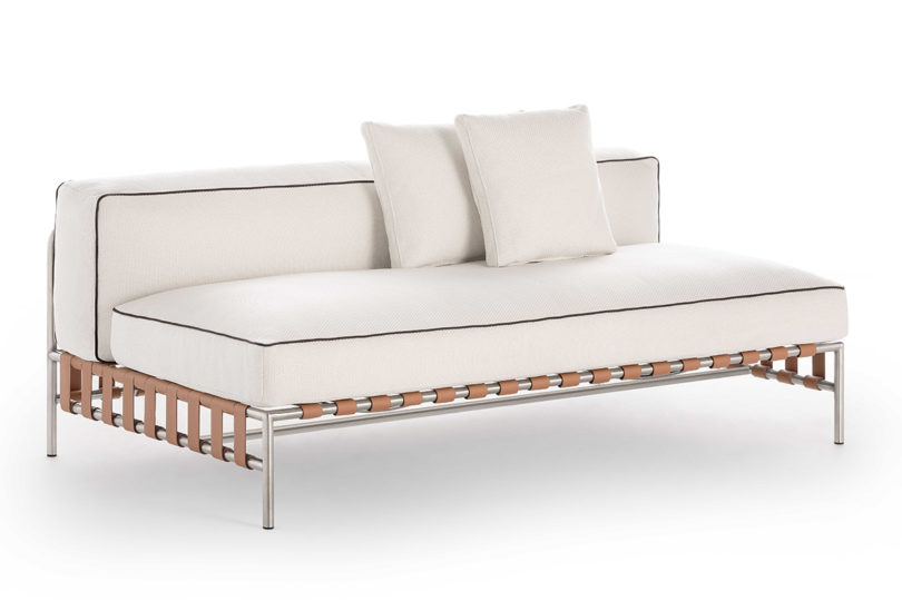 white upholstered armless sectional with matching pillows