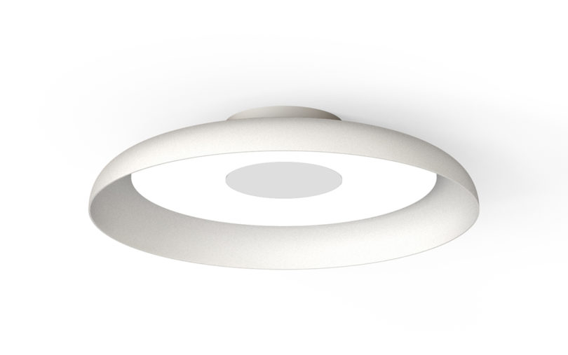 ceiling mounted white disc-shaped light on white background