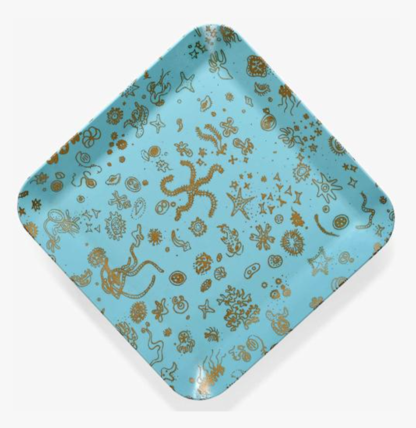 turquoise tray with bronze sea creatures pattern on white background