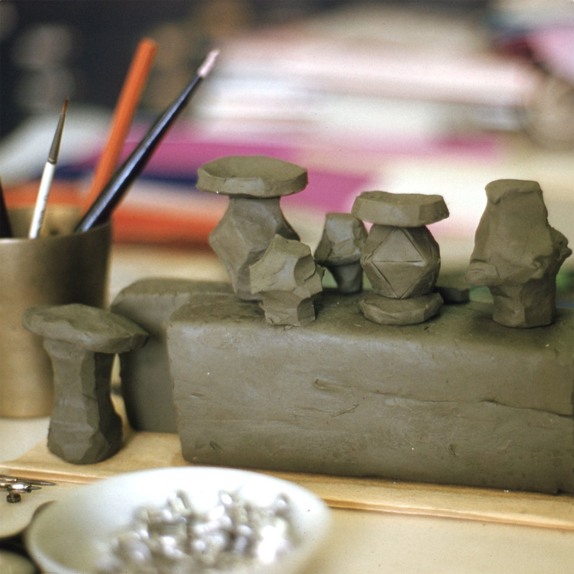 clay models of stools on a work surface