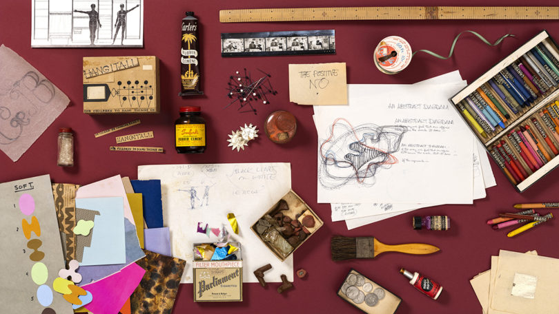 flat lay of sketches, ephemera, colored chalk, and more