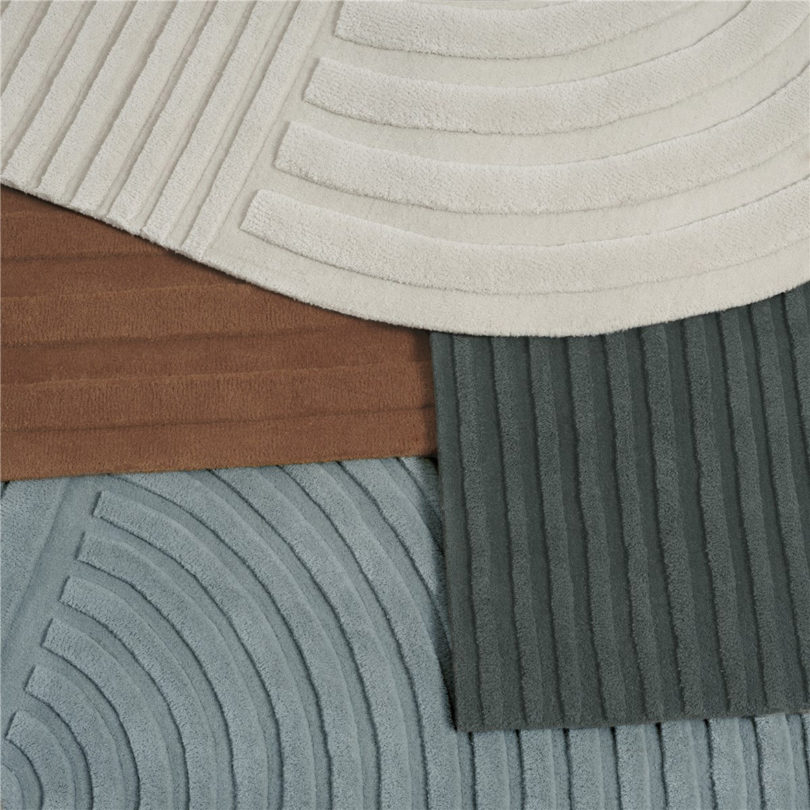 All four colors of Muuto Revolo wool rug shown overlapping one another.