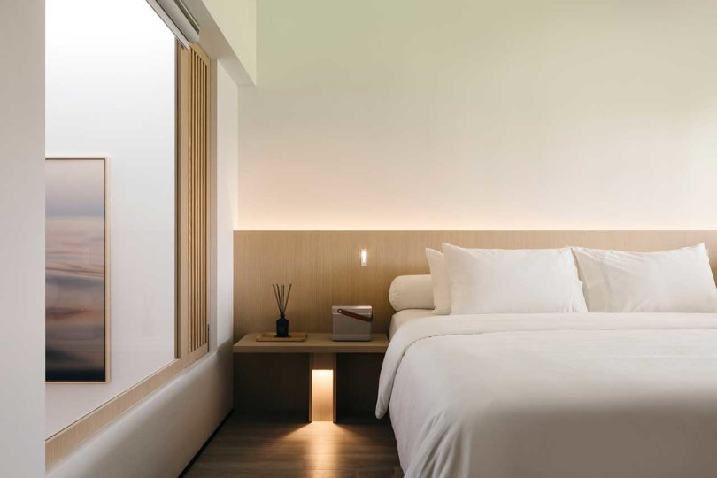view into minimalist bedroom through 