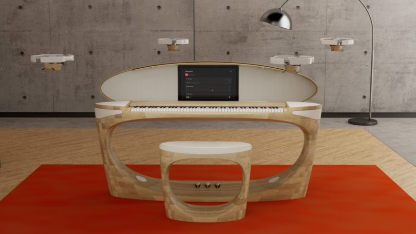 Front view of the Roland 50th Anniversary Concept Piano with lid open and seat in front.