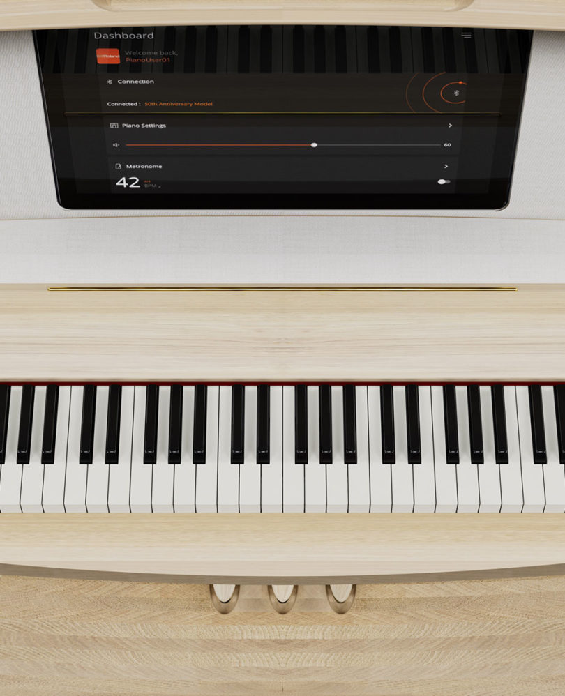 Detail shot of piano's center tablet display and overhead of keys.
