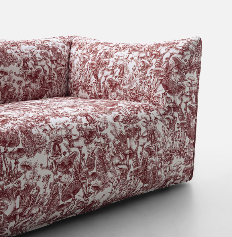 detail of dark red and white mushroom toile upholstered sofa