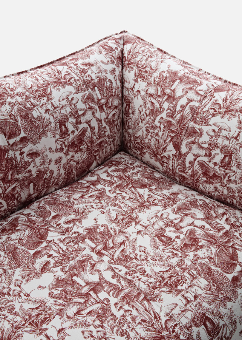 detail of dark red and white mushroom toile upholstered armchair