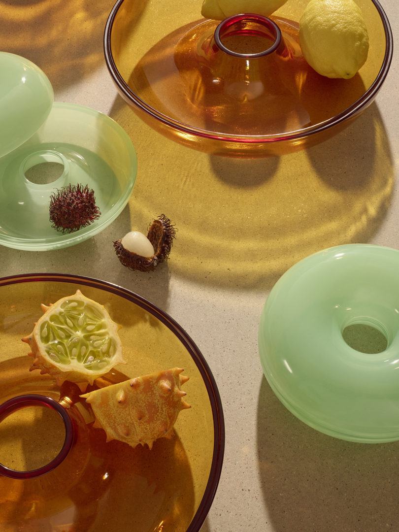 collection of orange and green donut-shaped objects in two different sizes
