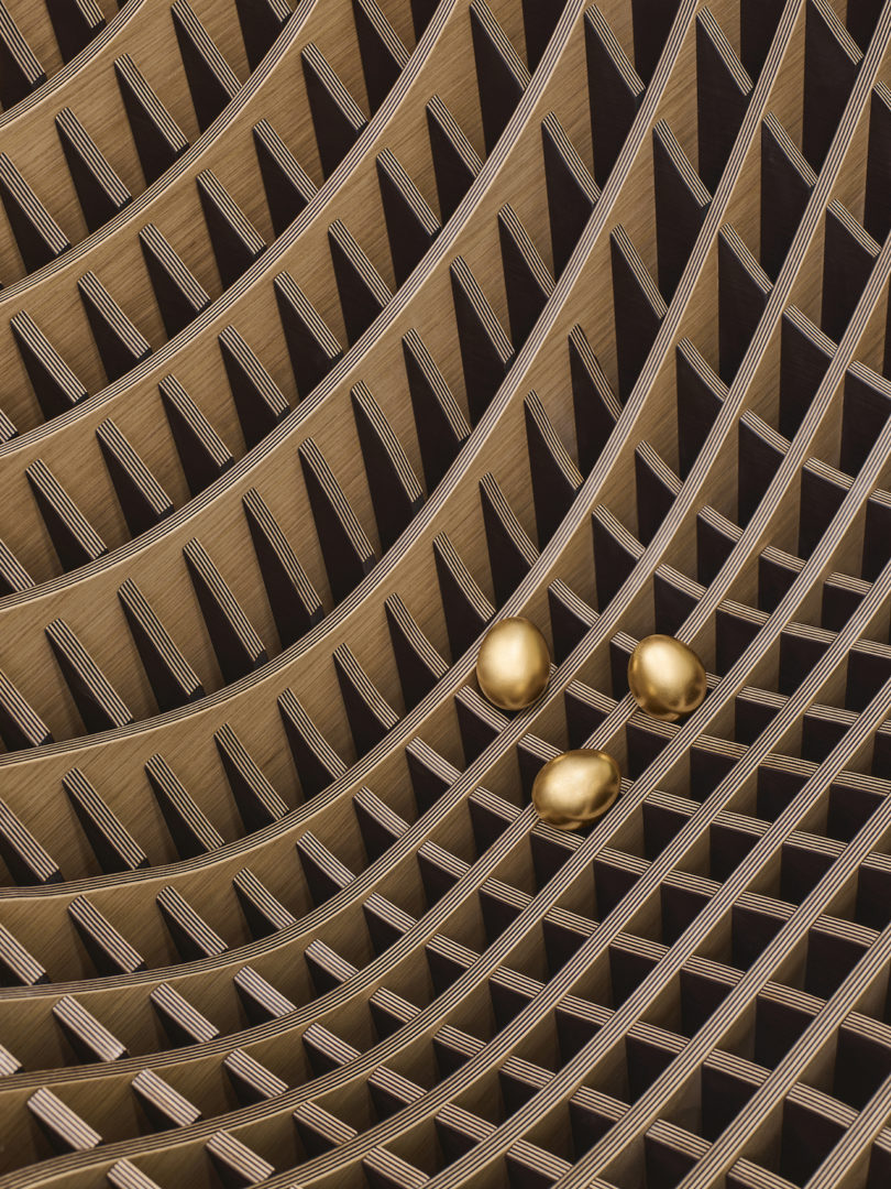 wood slat details of eggs on wooden curved chair