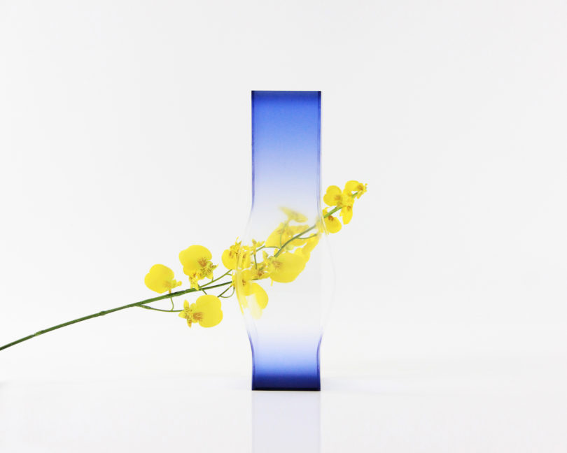 blue vase with yellow flowers