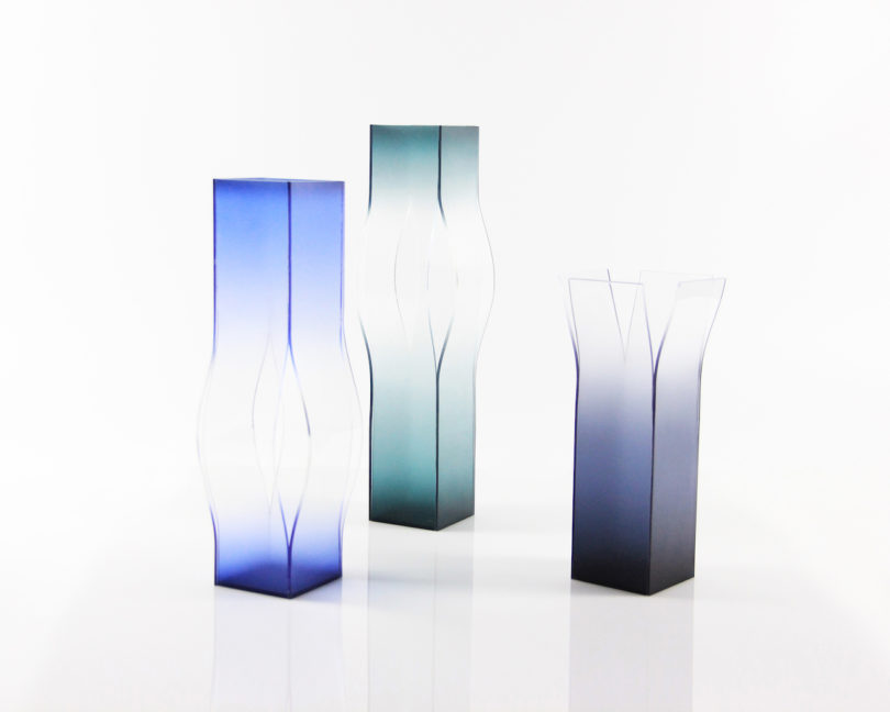 three transparent vases