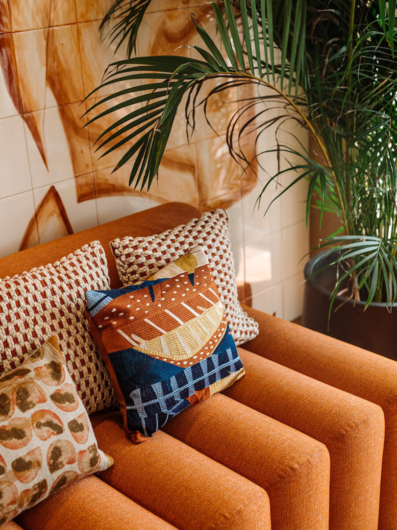 Accented orange sofa, the themed color of the hotel