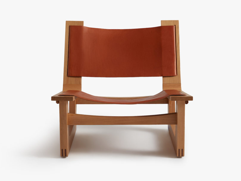 product shot of brown leather sling chair 