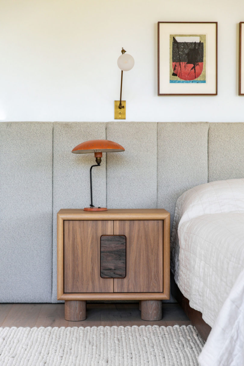 wooden nightstand in bedroom