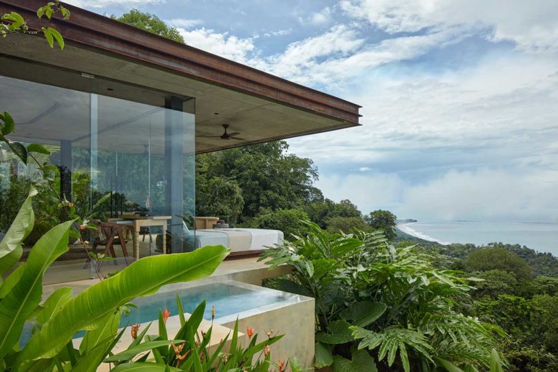 side view of modern villa looking out over green hillside