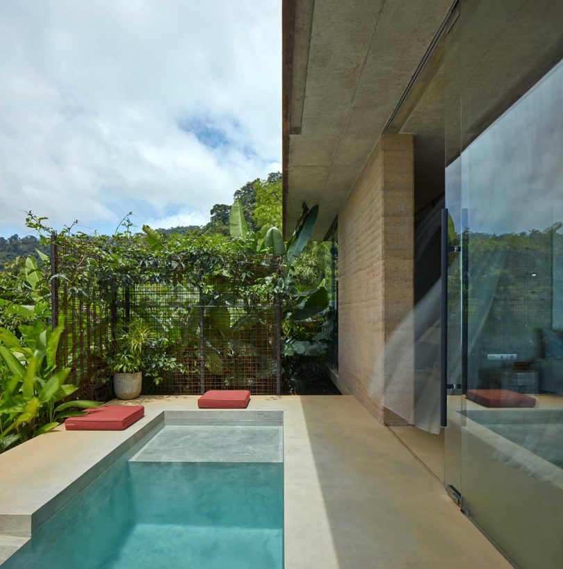 side view of modern tropical villa with small built-in pool