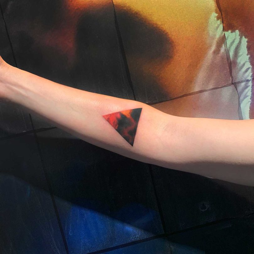 view of arm with triangular Amanda Wachob tattoo