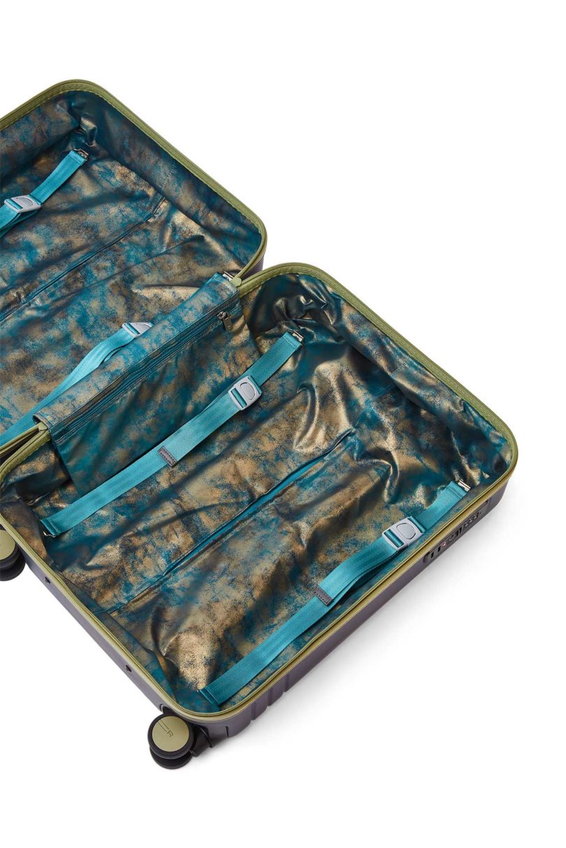 angled down view of open suitcase with iridescent lining