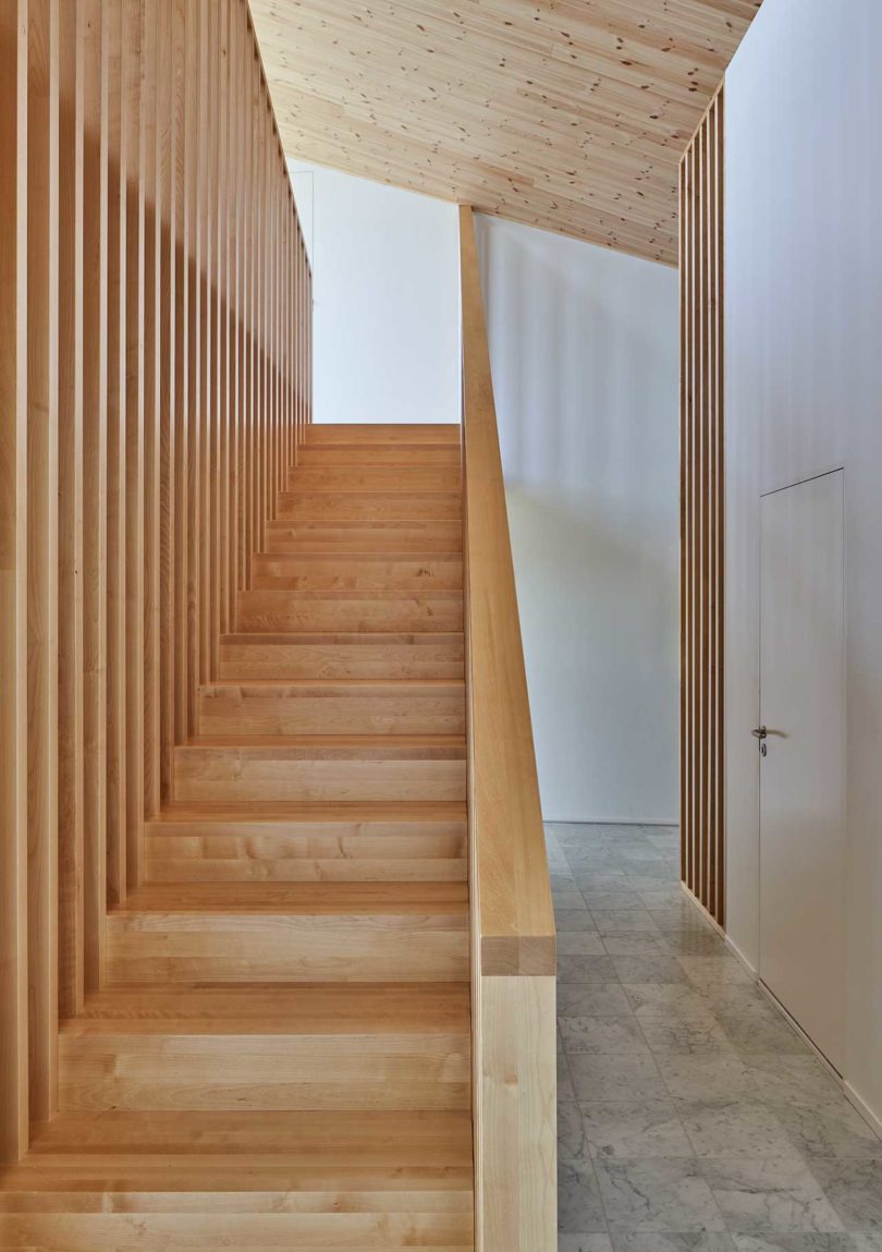 modern house interior looking up wood stairs