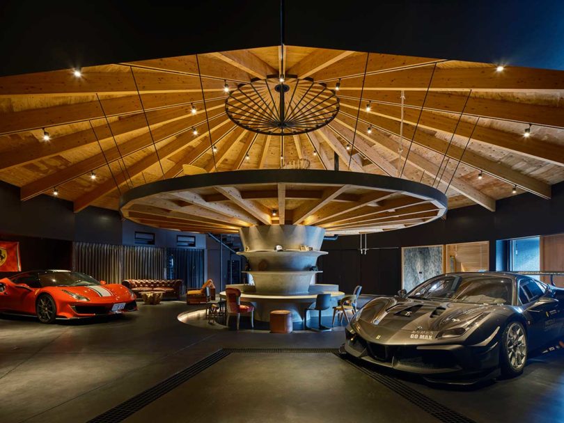 interior of domed modern home with two cars inside