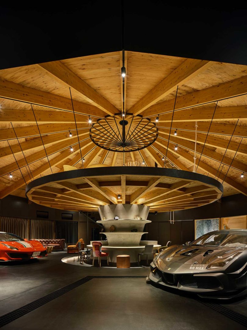 interior of domed modern home with two cars inside