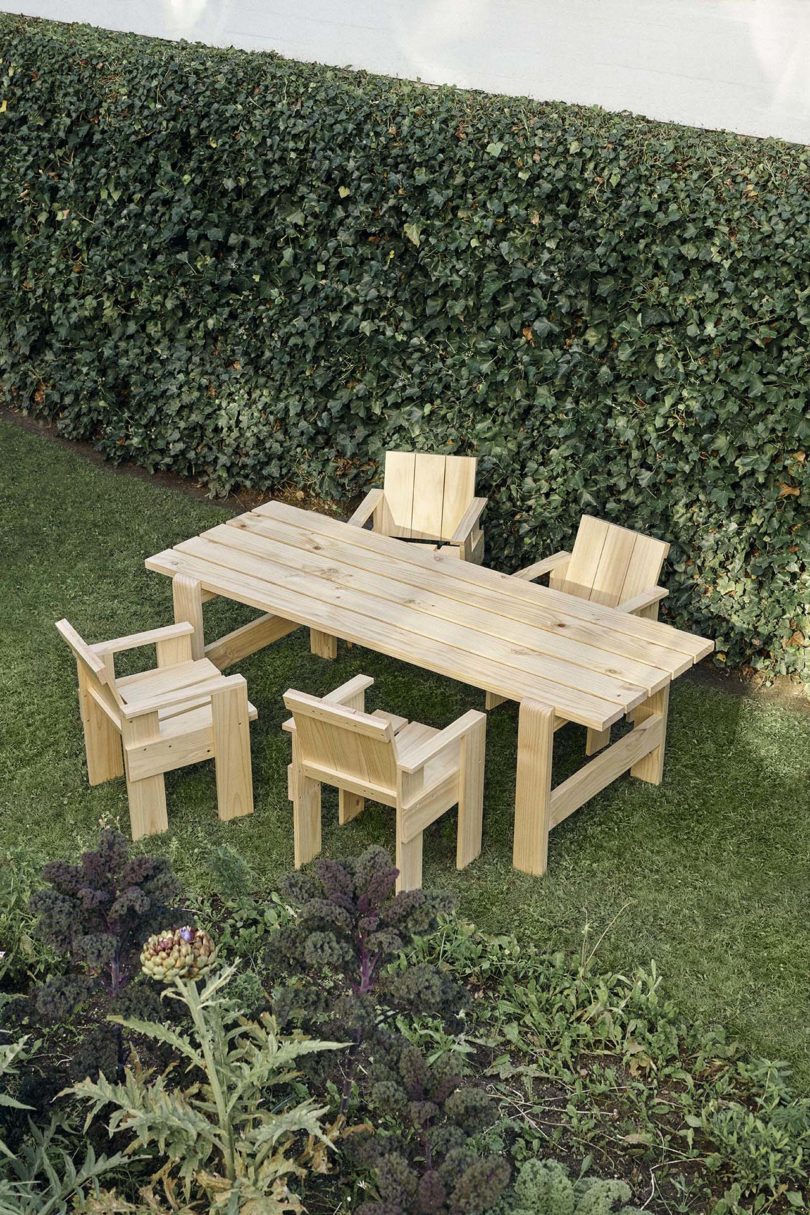 outdoor wood dining table and four armchairs
