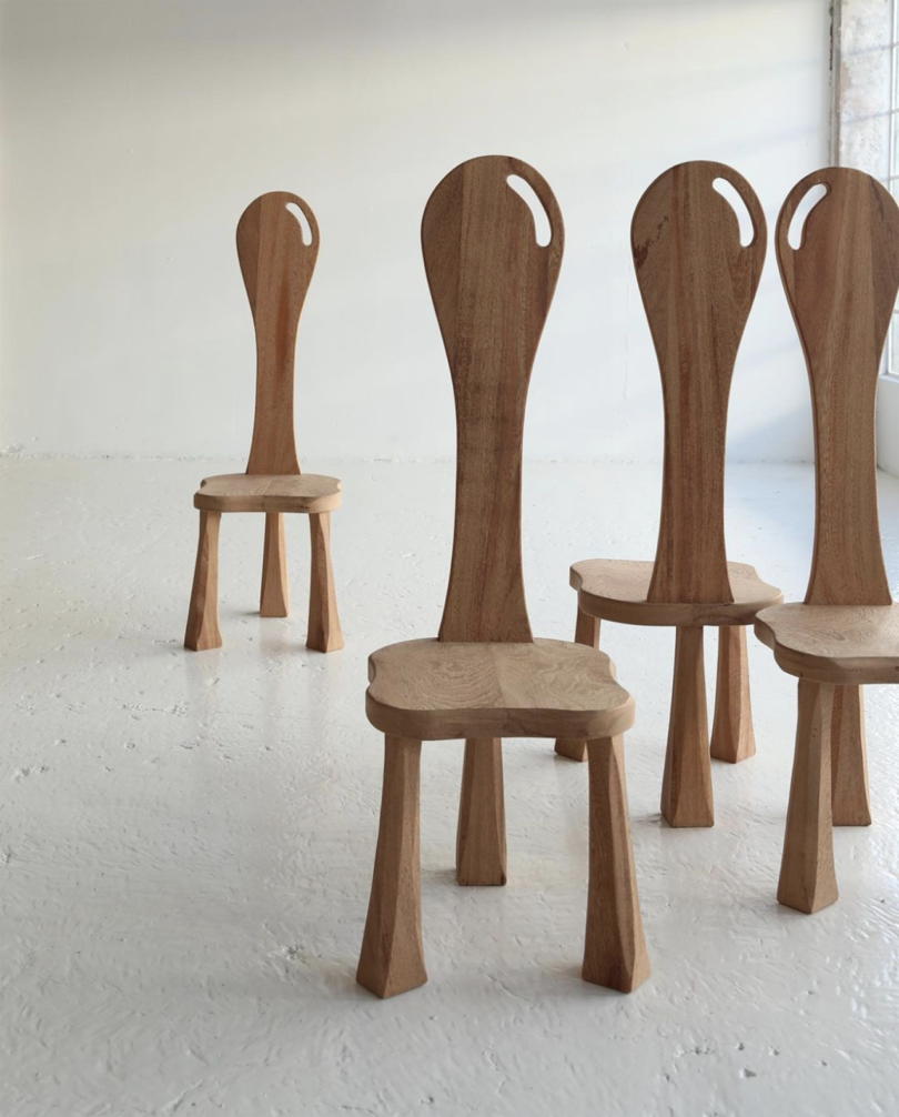 four extremely high back wooden chairs