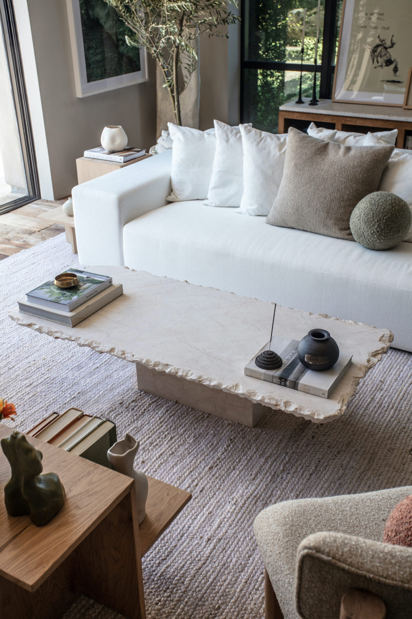 styled living space with white sofa and rectangular coffee table