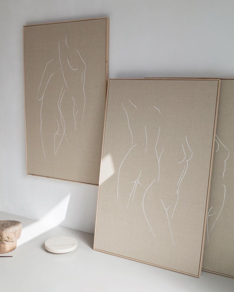 three linen canvases with white chalk figure silhouettes