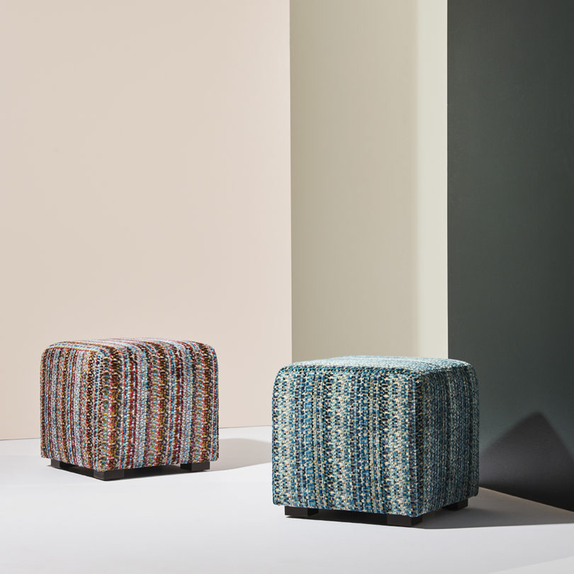 two upholstered cube-shaped stools