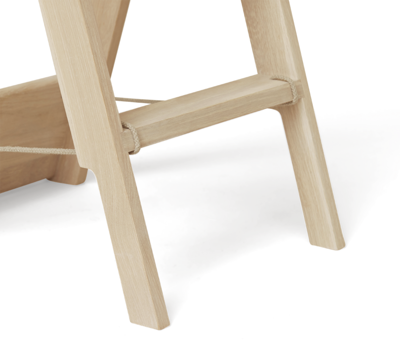 detail of foldable wood ladder on white background