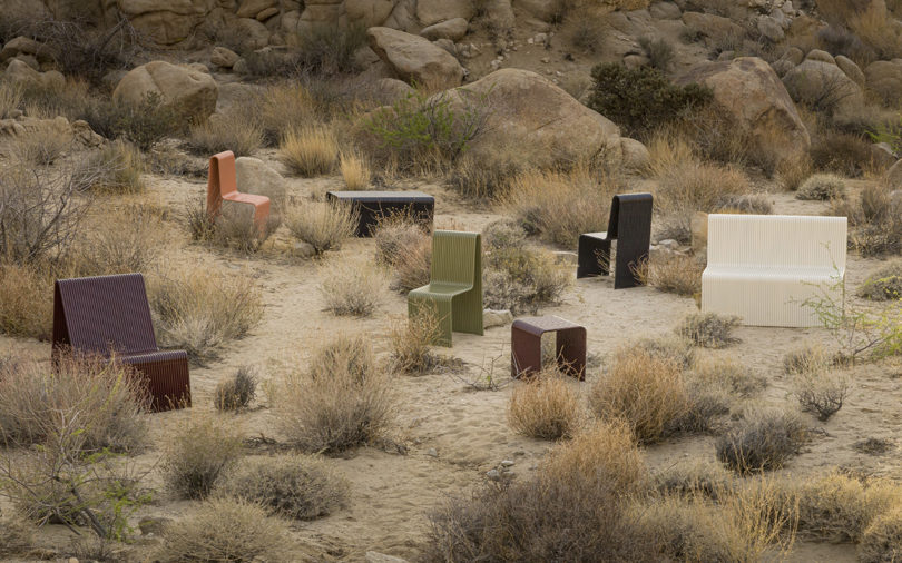 a collection of modern metal outdoor furniture in the desert