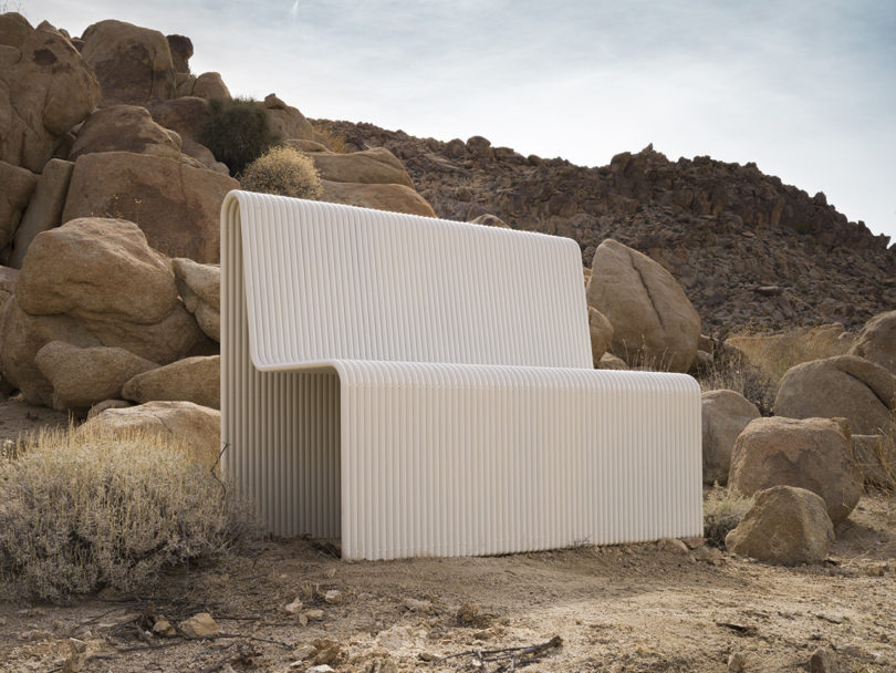white metal bench in the desert