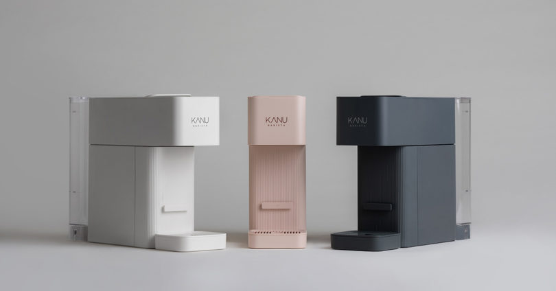 White, light pink and black modern coffee makers from front angle perspective.