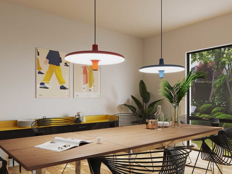 orange and blue pendant lamps over dining table