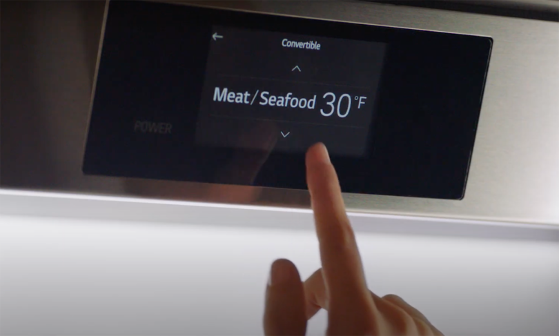 finger interacting with a touchscreen that reads Meat/Seafood 30º