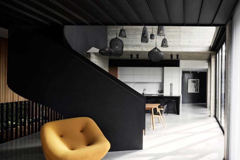 modern kitchen with white cabinets and black island