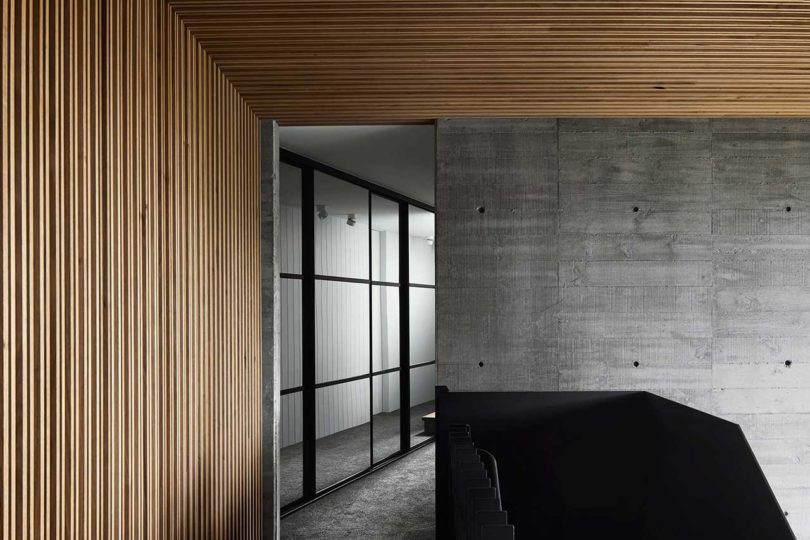 modern interior with concrete walls and wood ceiling