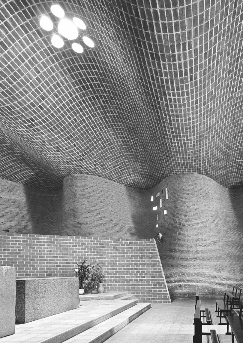 black and white image of the interior of a space, modern building