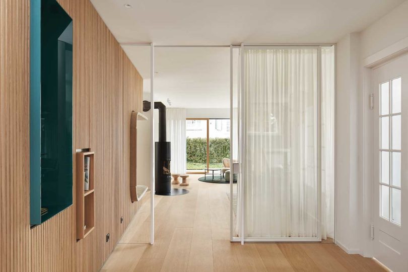 interior view looking through modern house through glass partition
