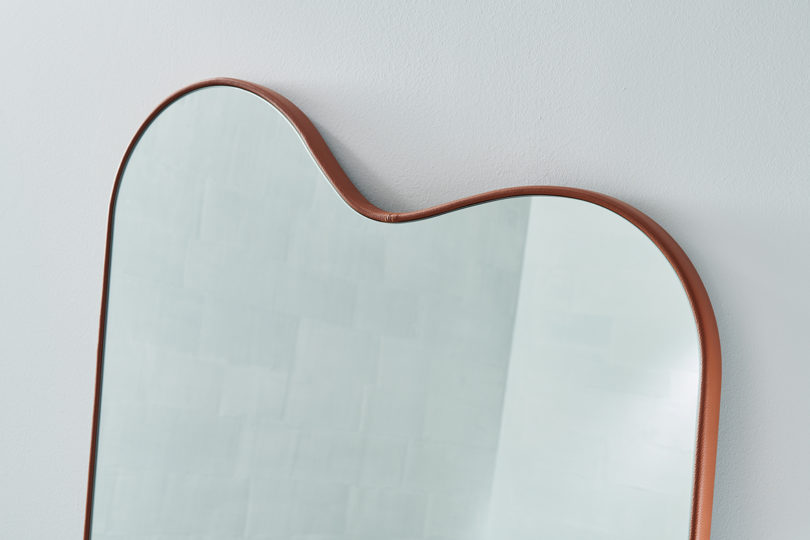 detail of floor mirror with curved top