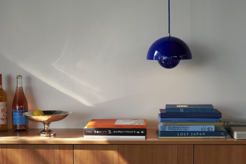 cobalt blue pendant light above sideboard