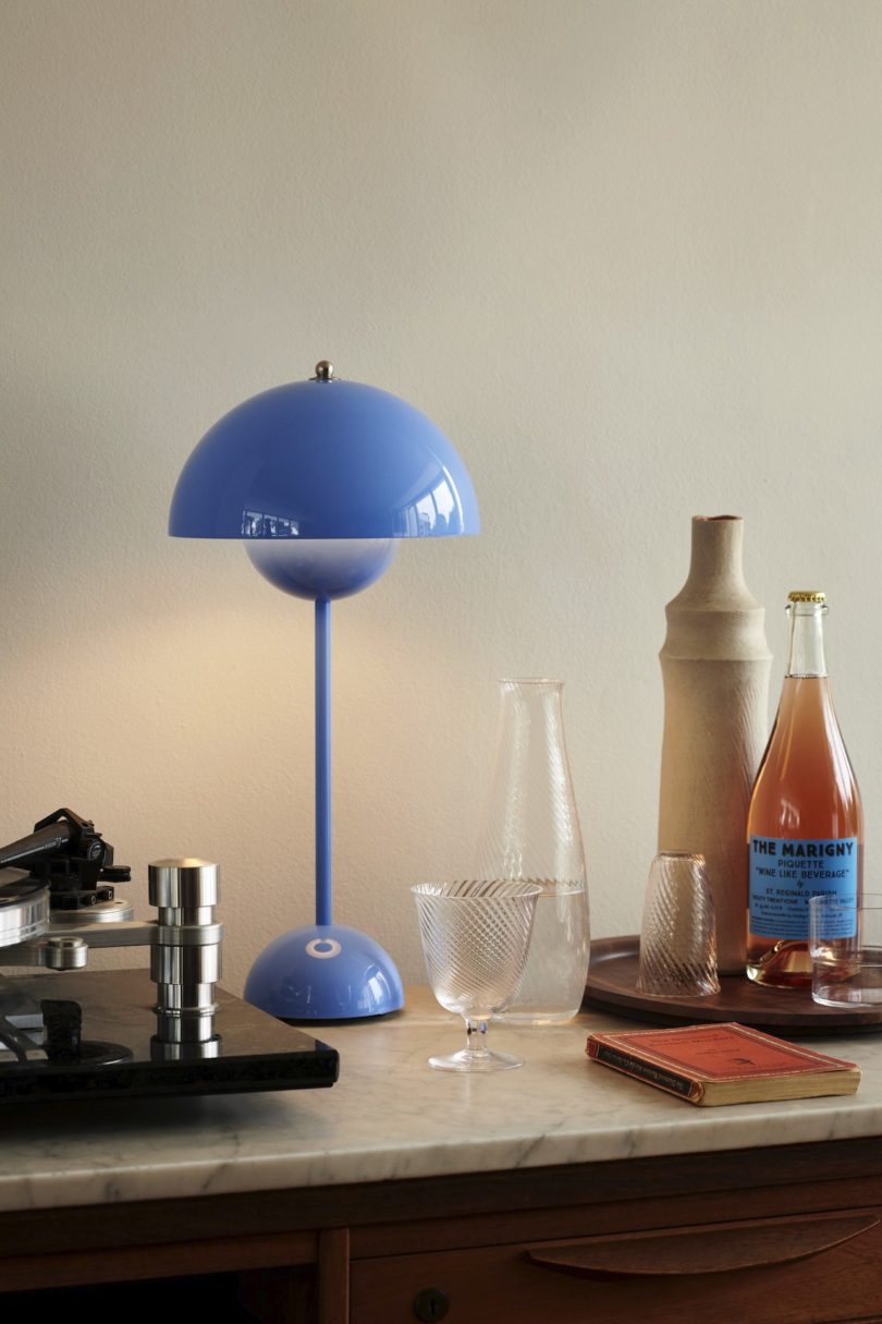 blue pendant lamp next to drinks