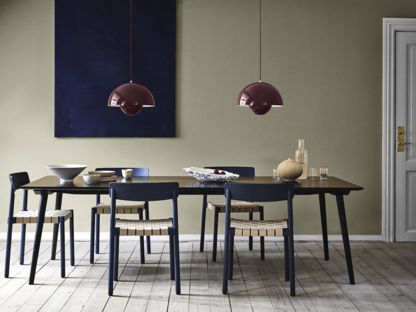 two dark plum pendant lights over dining table