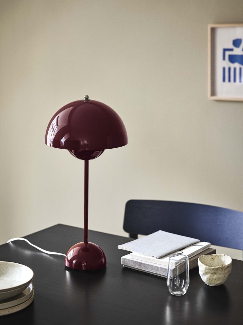 plum colored table lamp on desk