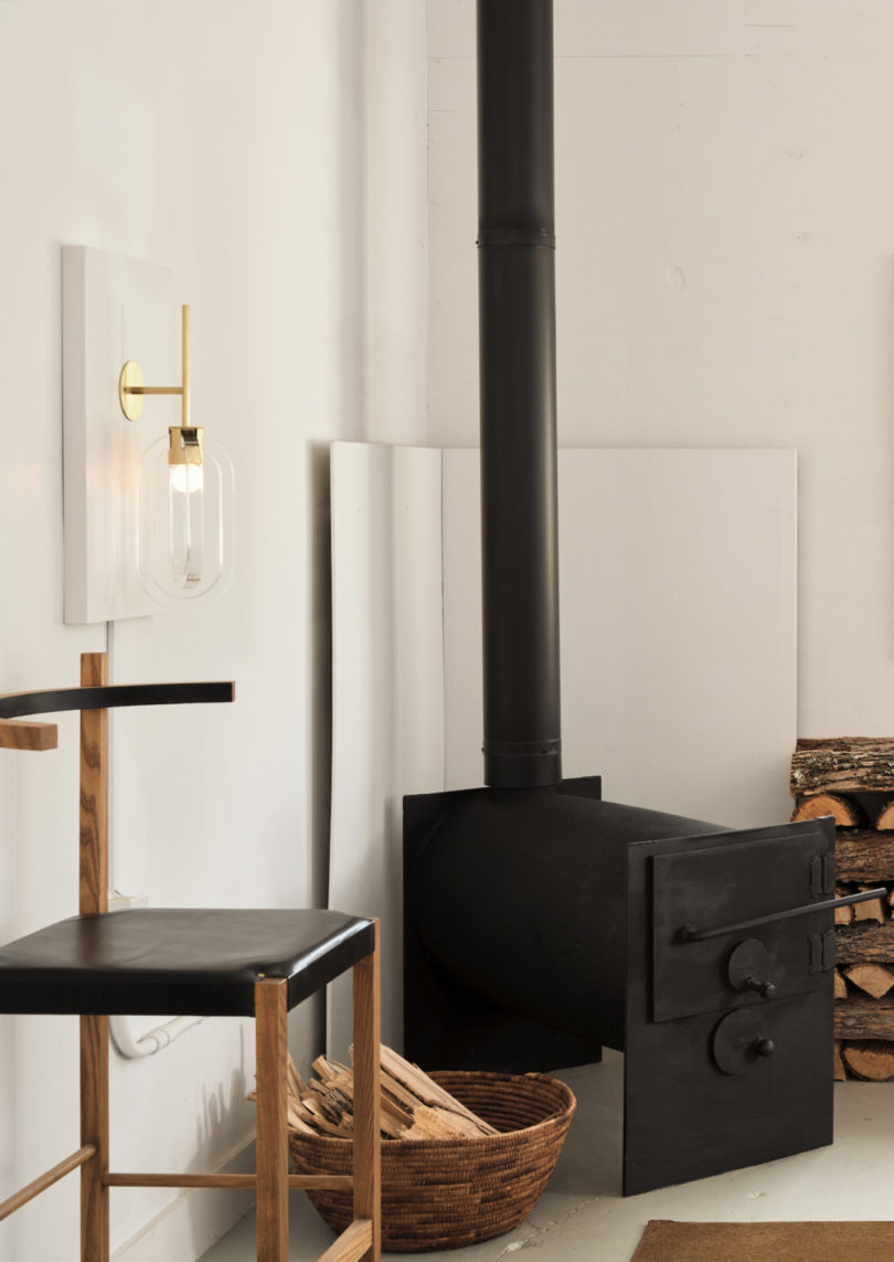 Working wood-burning fireplace within Coil + Drift's Catskill studio space
