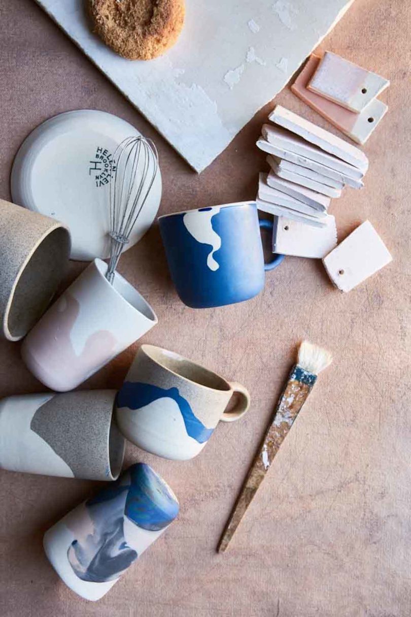 mugs on their sides with tools and glaze swatches