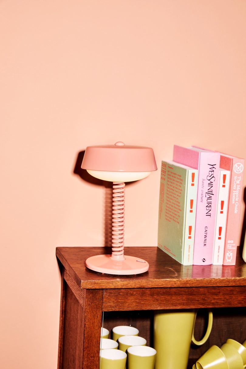 pink table lamp on wood table
