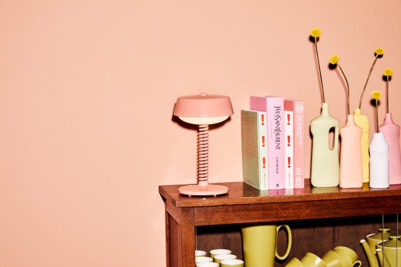 pink table lamp on wood table